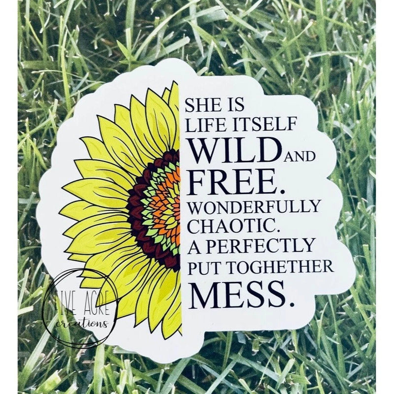 Sunflower sticker with quote text: She is life itself, wild and free, chaotic mess.