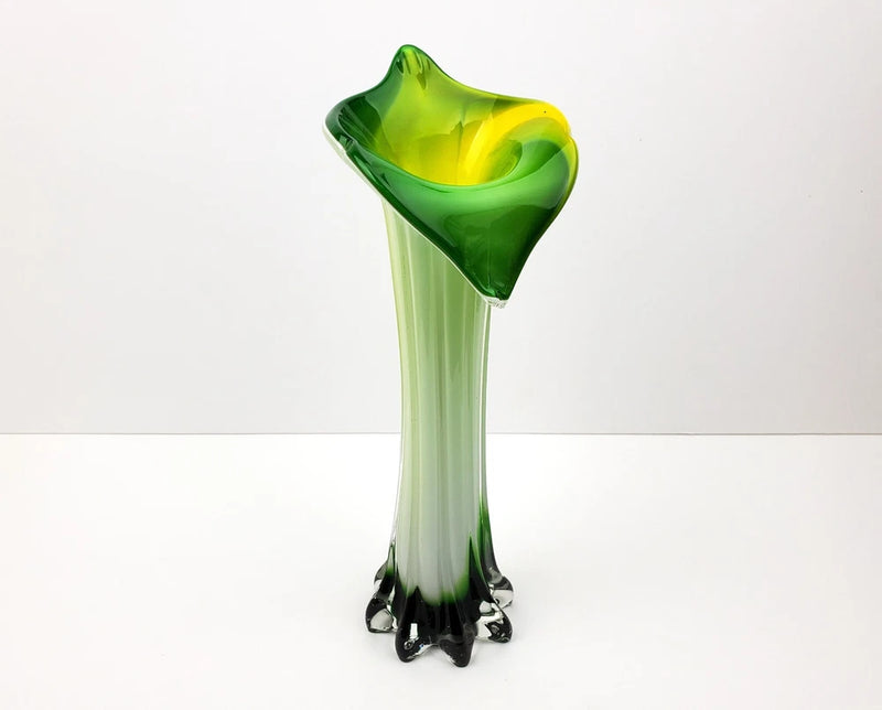 Green hand-blown glass lily vase with flared rim and dark foot