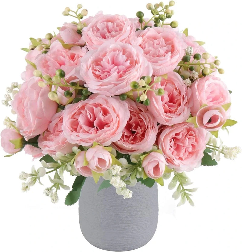 Artificial pink faux peony silk flower bouquet with greenery and small blooms in gray vase