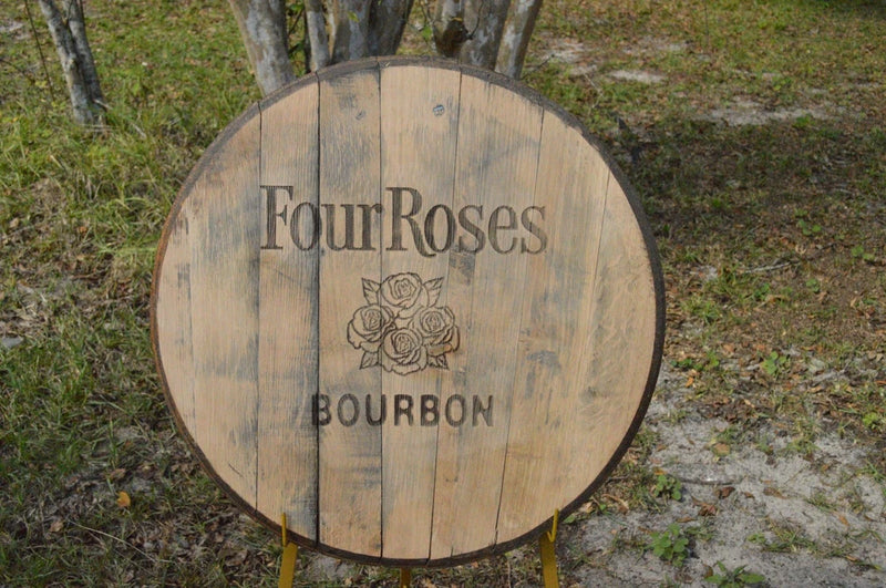 Four Roses bourbon barrel head lid with rose emblem, round weathered wood