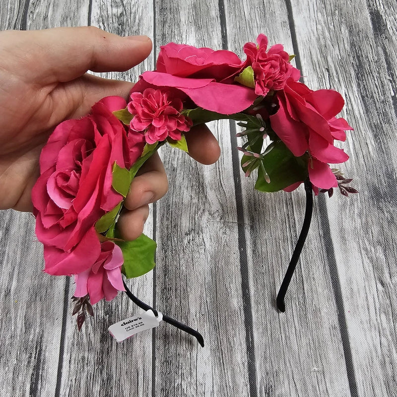 Floral rose metal headband with dark band and large red fabric blossoms
