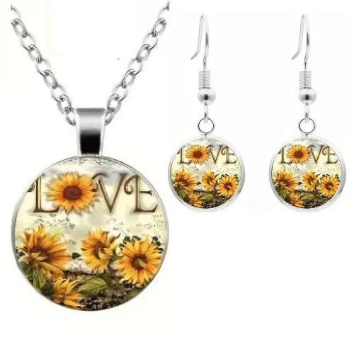 Sunflower glass pendant necklace and matching LOVE drop earrings set with silver-tone hooks