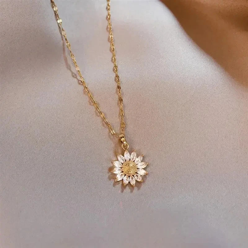 Sunflower pendant necklace with gold-tone chain and small rhinestone flower charm