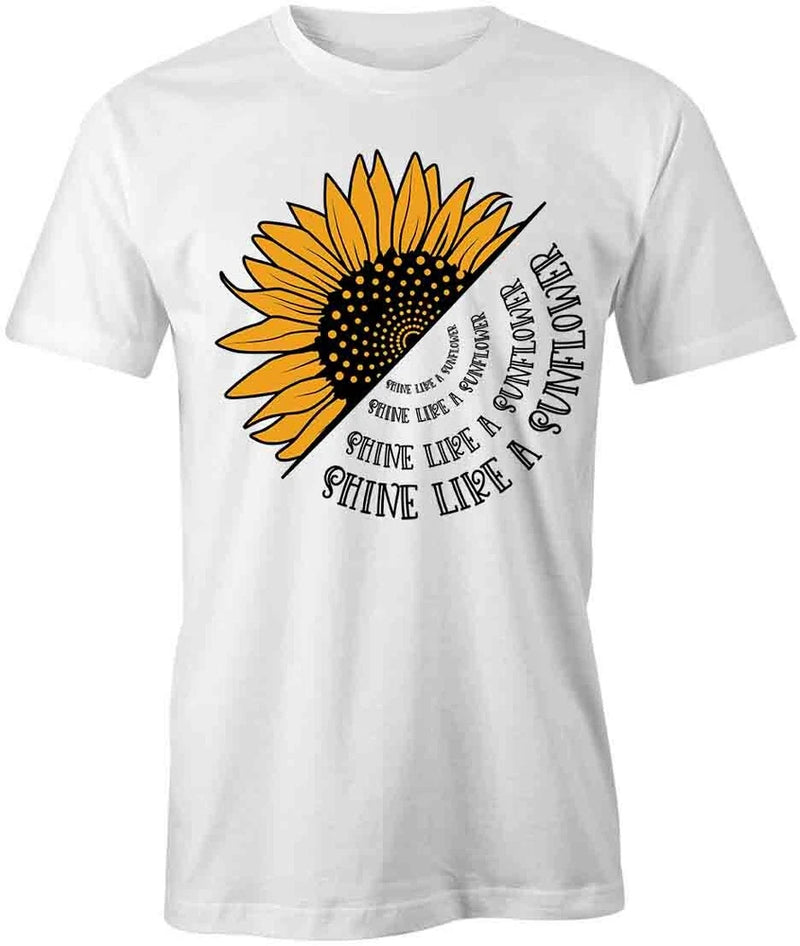 White short-sleeve cotton T-shirt with large sunflower graphic and 'SHINE LIKE A' text