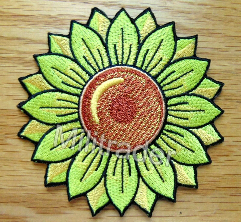 Embroidered sunflower patch with green petals and yellow center, stitched detail