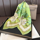 Green silk square scarf with white and yellow peony floral print and decorative border