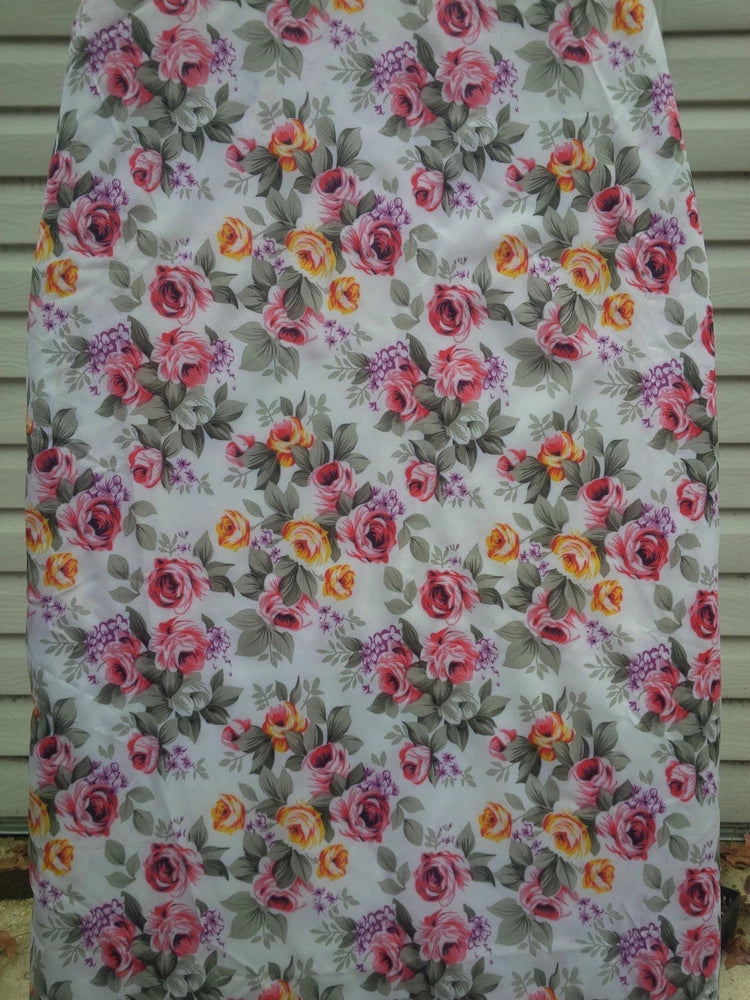 Ironing board cover with multicolor rose floral print on light fabric