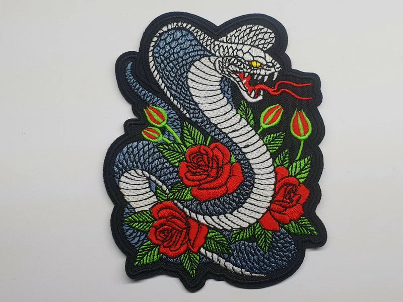 Embroidered snake and rose patch, dark fabric with coiled cobra and red flowers