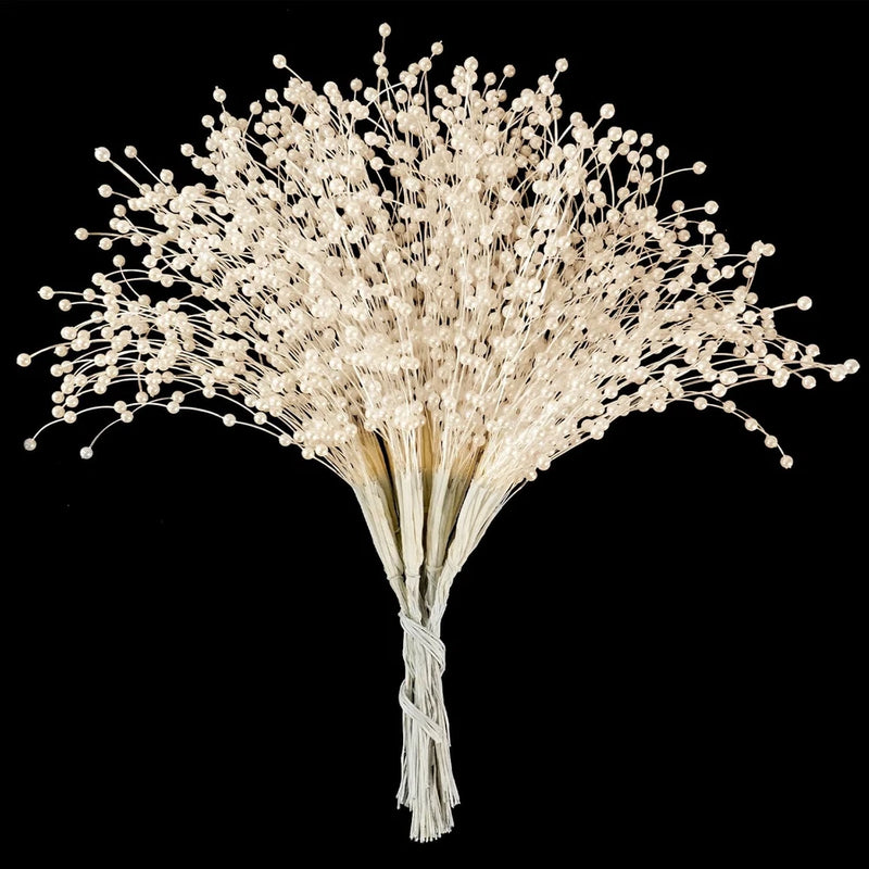 Pearl beaded stick bouquet with white bead stems gathered into a tied bundle