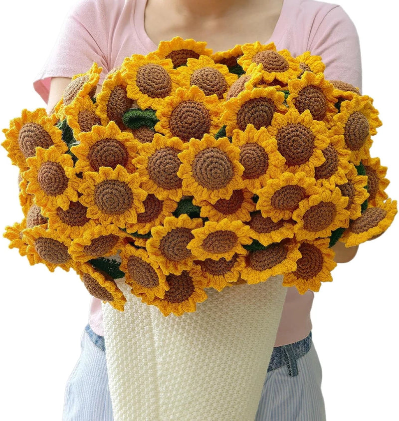 Handmade crochet sunflower blanket with yellow and brown flower appliques, draped over torso