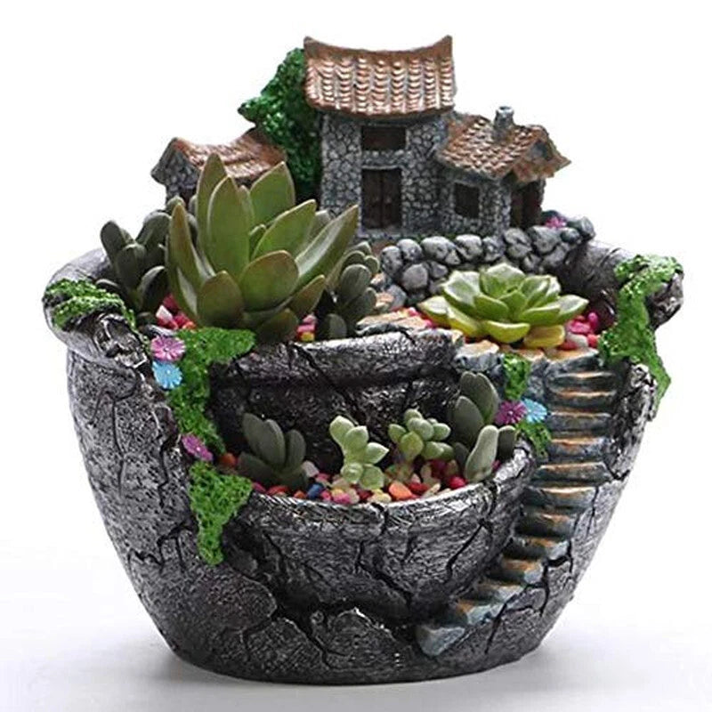 Resin succulent planter pot with dark stone texture and multiple green succulents