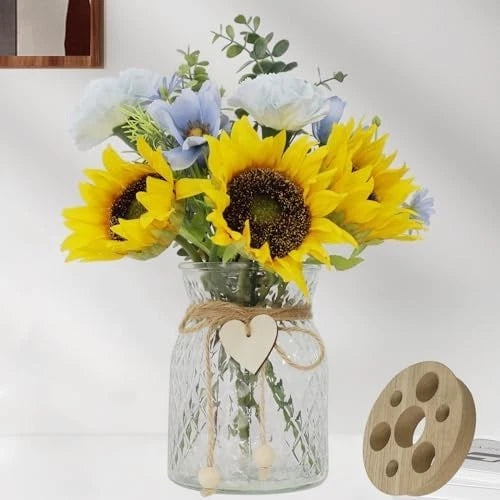 Sunflower faux flower centerpiece in clear glass vase with blue blossoms and twine heart tag