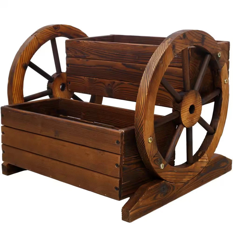 Brown wooden wagon planter box with two large wheel ends and slatted planter sides