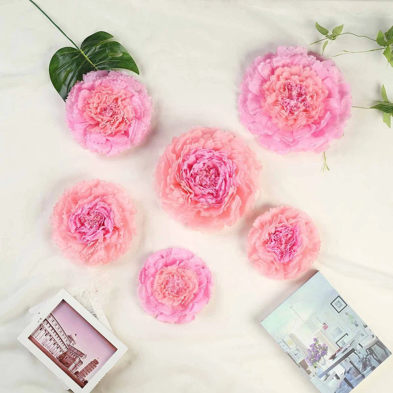 Set of pink tissue paper carnation flowers with round layered blooms