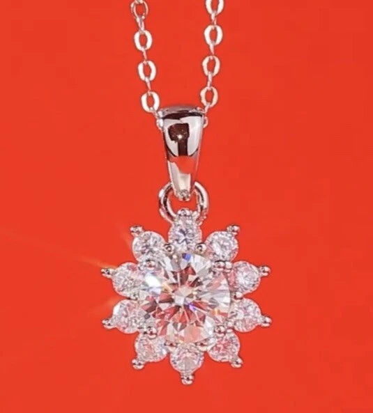 Sunflower crystal pendant necklace with round center and faceted petal stones, link chain.