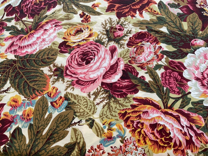 Floral rose print fabric with pink, burgundy, and cream bursts