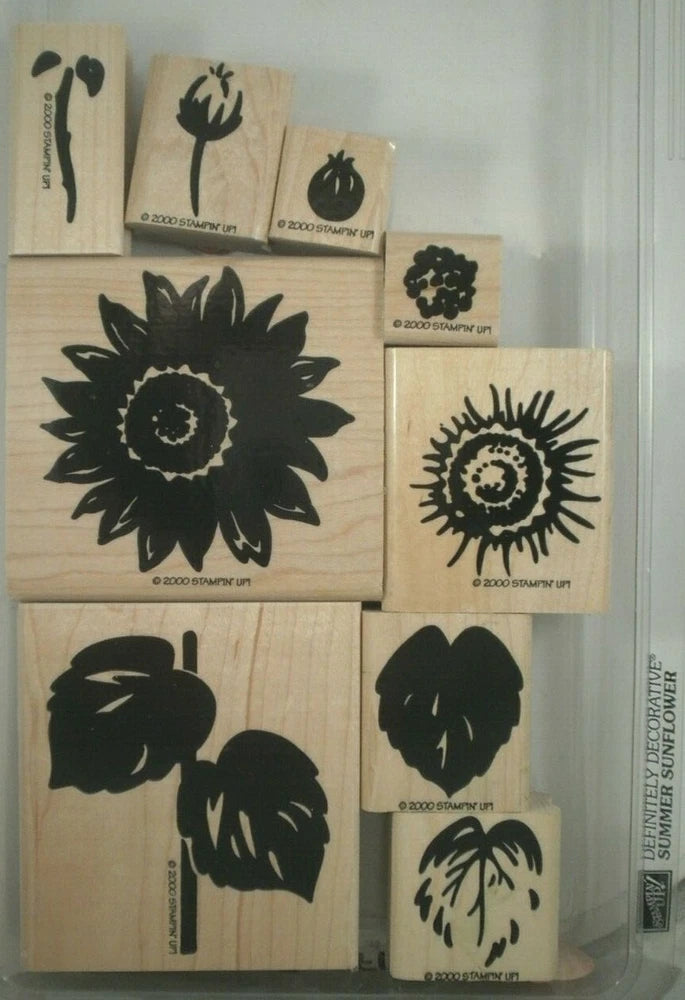 Wood-mounted rubber stamp set with black sunflower designs on wooden blocks