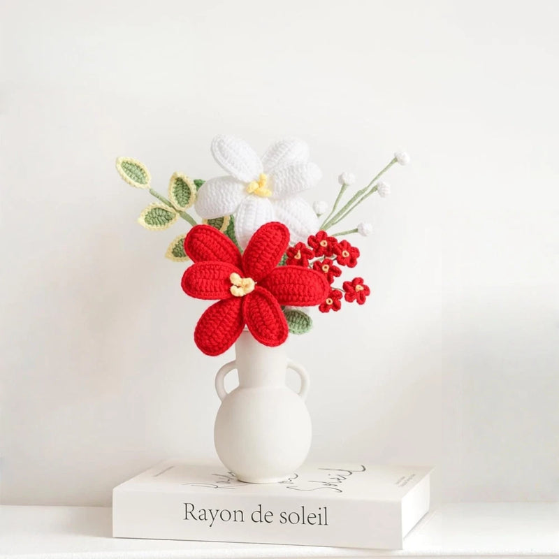 Crochet flower bouquet with wear vase, white vase with red and white blossoms and green leaves