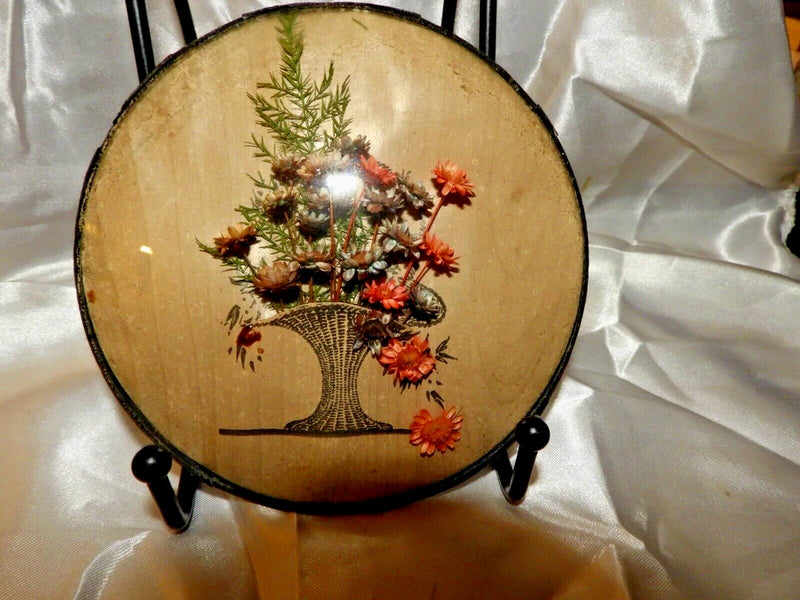 Round convex glass frame with dried fern and flowers on tree illustration in basket