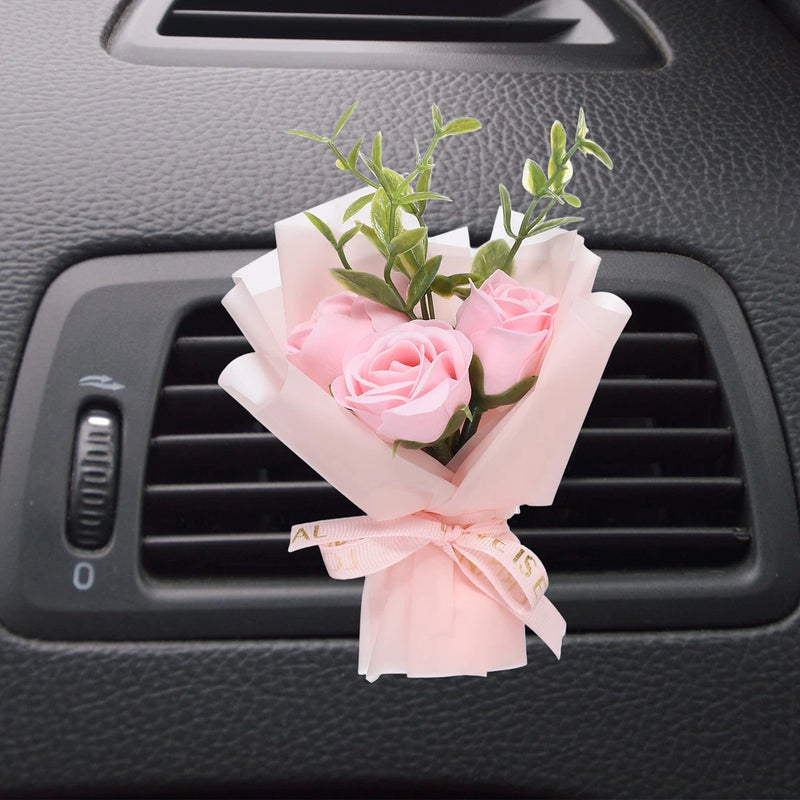 Pink rose dried flower car vent clip diffuser with ribbon and green leaves