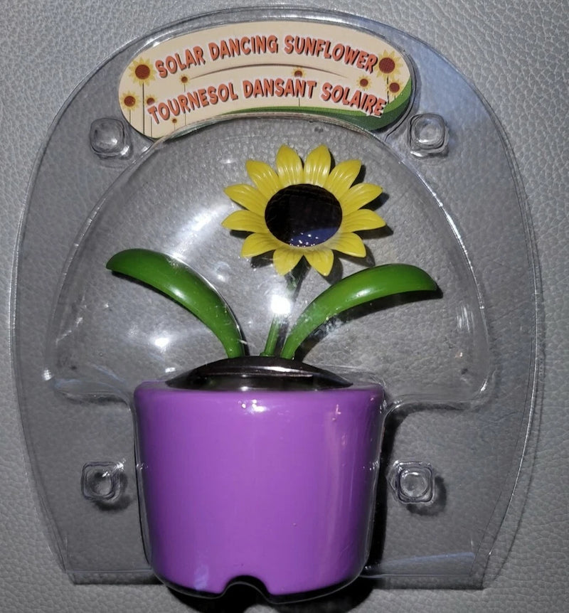Solar dancing sunflower bobblehead toy with yellow flower, purple pot, green leaves