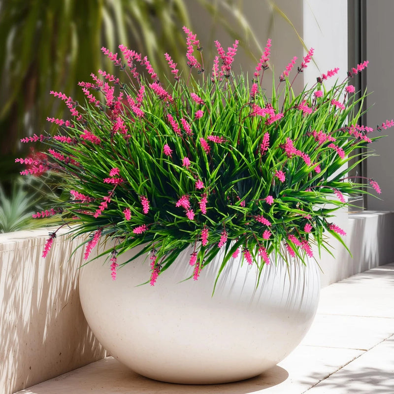 Artificial lavender flowers faux plant bunch with green leaves and pink blooms in white pot