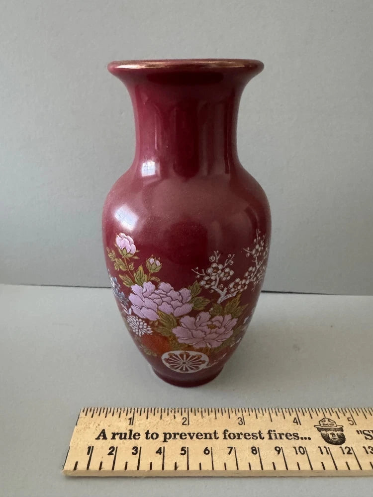 Burgundy ceramic vase with hand-painted peony and floral pattern, rounded silhouette