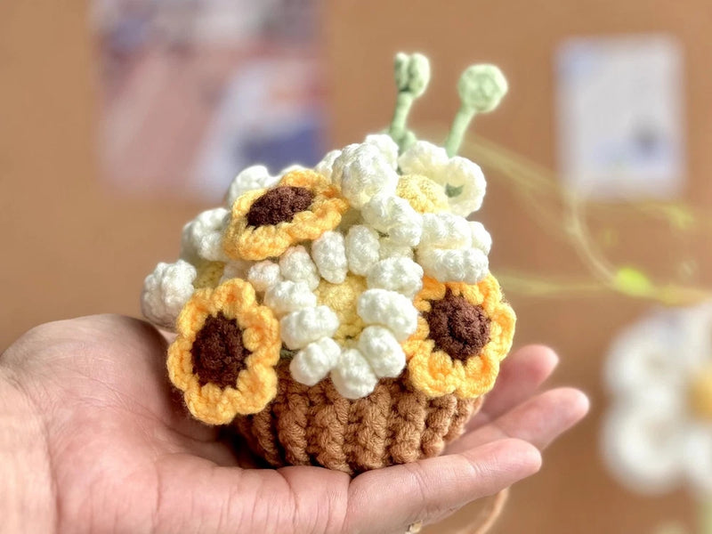 Handmade crochet hanging basket with sunflower appliques, dark centers and green stems