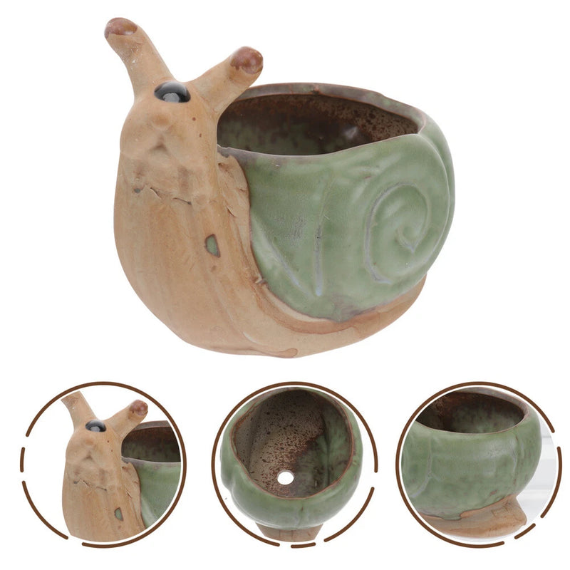 Snail-shaped ceramic plant pot with green glazed interior and round opening