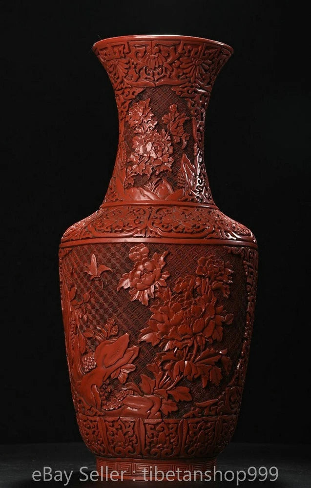 Red lacquerwork vase with carved peony and bird motifs, tall flared rim