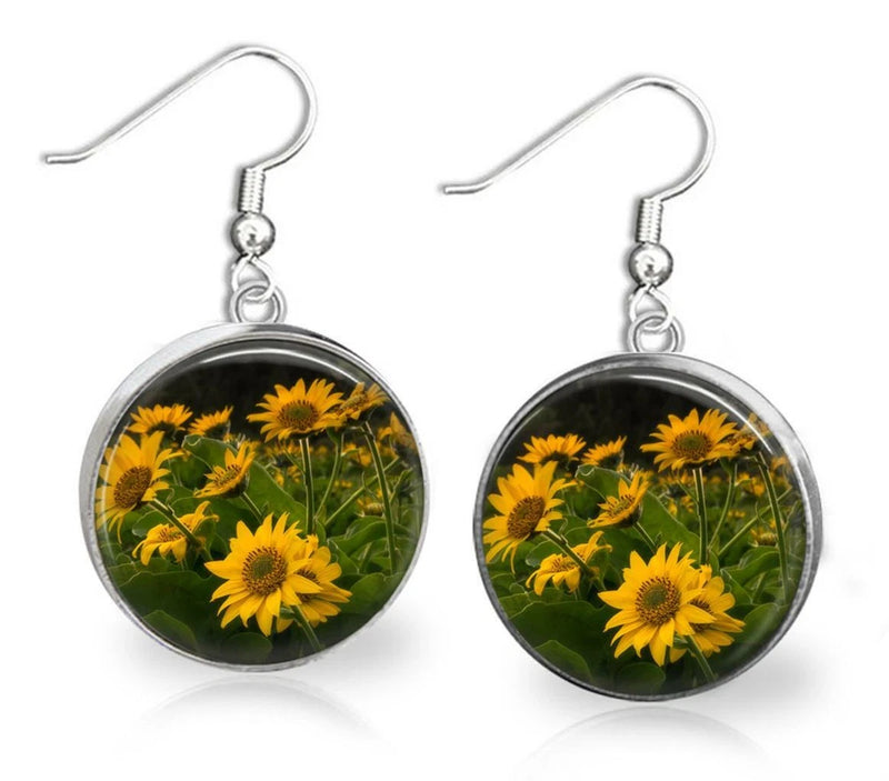 Round sunflower glass dangle earrings with silver hooks and vivid yellow flower print