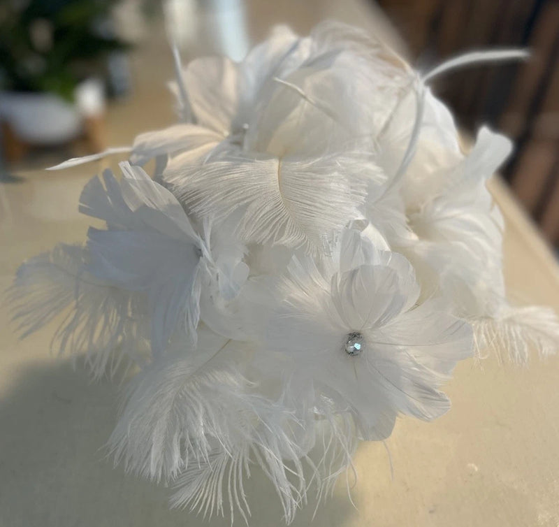 White feather bridal bouquet with rhinestone accent flower detail