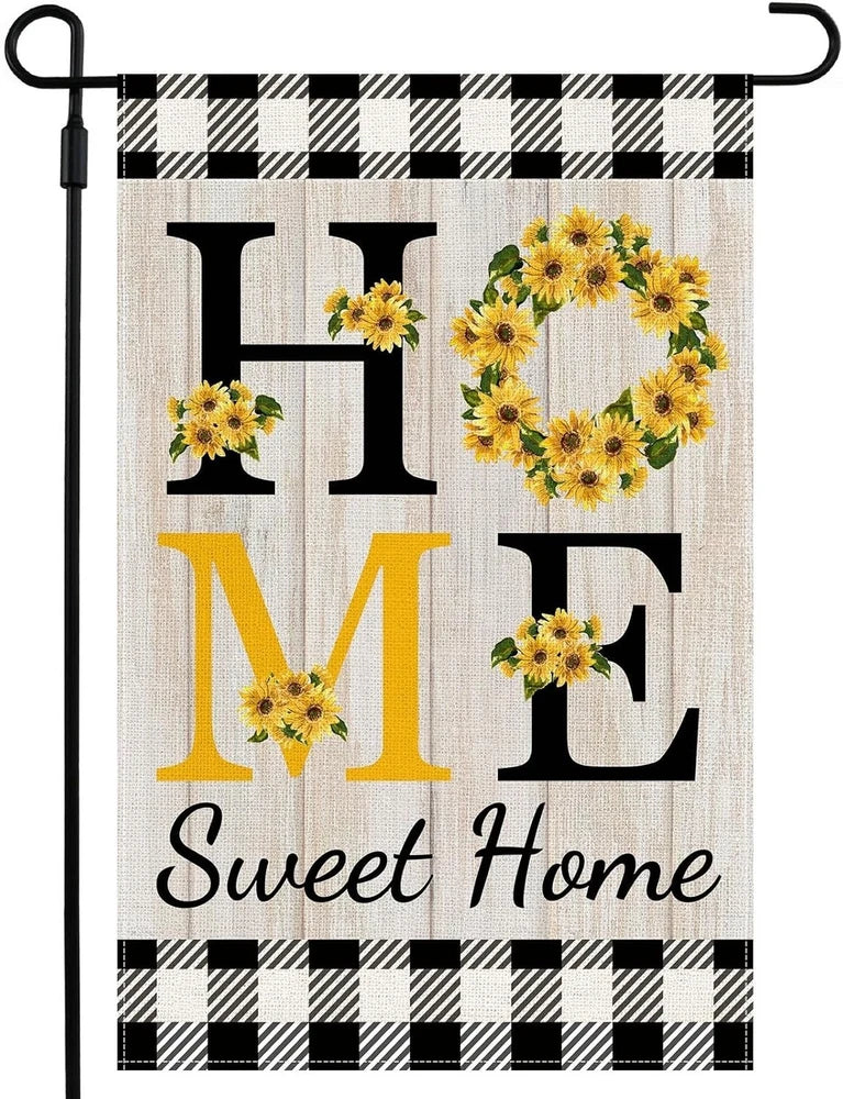 Farmhouse garden flag with black plaid border, sunflower wreath, and 'Sweet Home'.