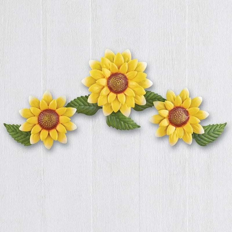 Metal sunflower wall decor with three bright yellow flowers and green leaves