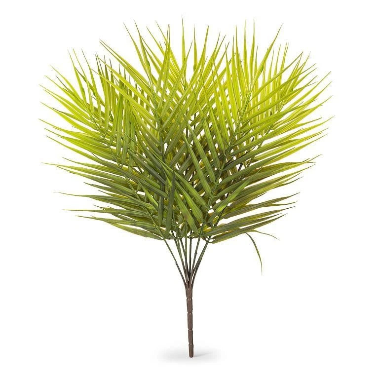 Green faux palm spray plant with leafy fronds on a brown stem