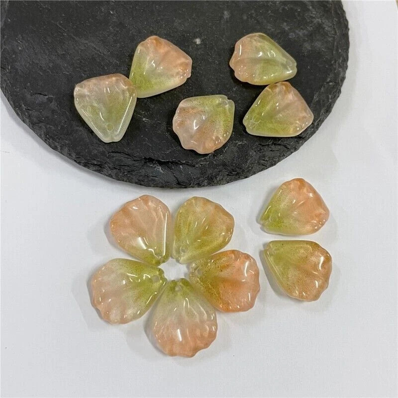 Assorted glass flower petal beads, pastel peach and yellow, faceted shapes