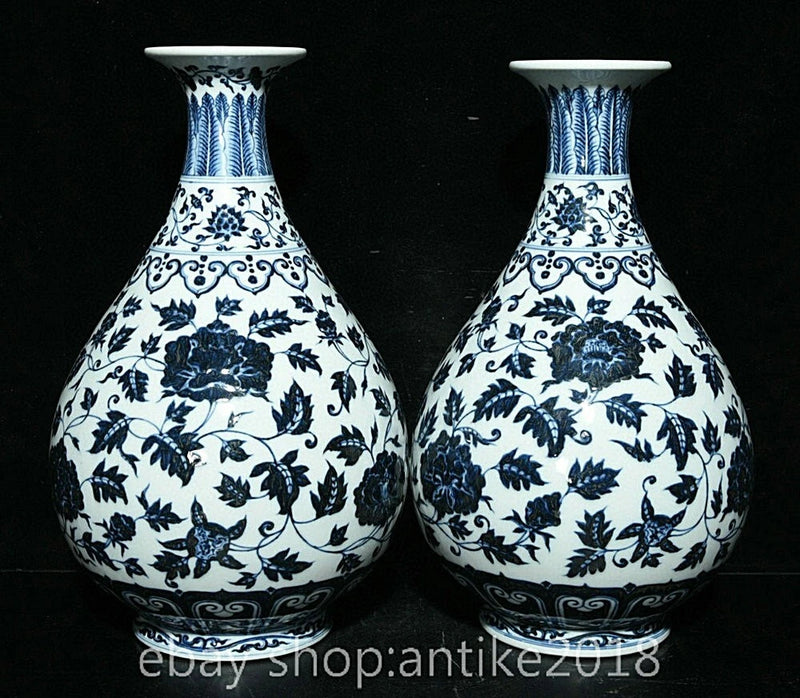 Pair of blue-and-white porcelain vases with floral scroll patterns and flared rims