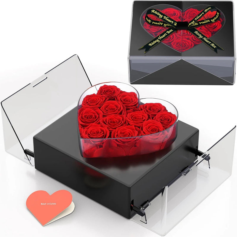 Black heart-shaped gift box with red preserved roses bouquet centerpiece