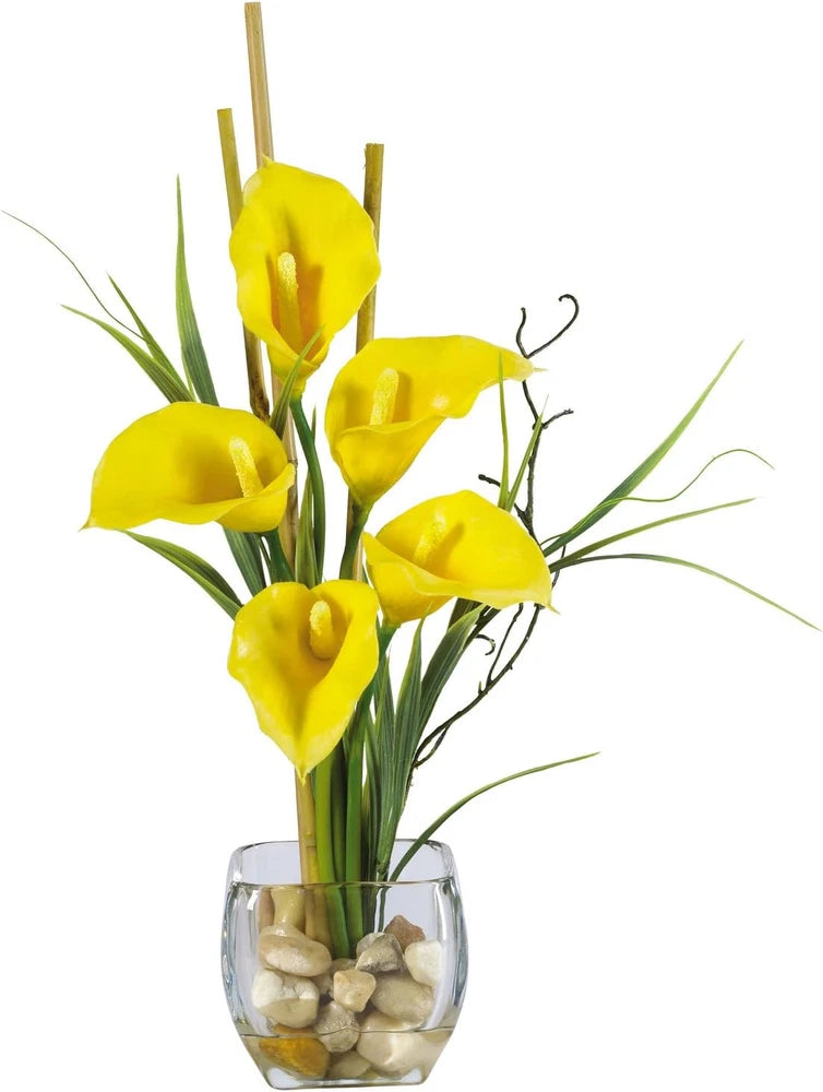 Yellow silk calla lily arrangement in clear glass vase with stems
