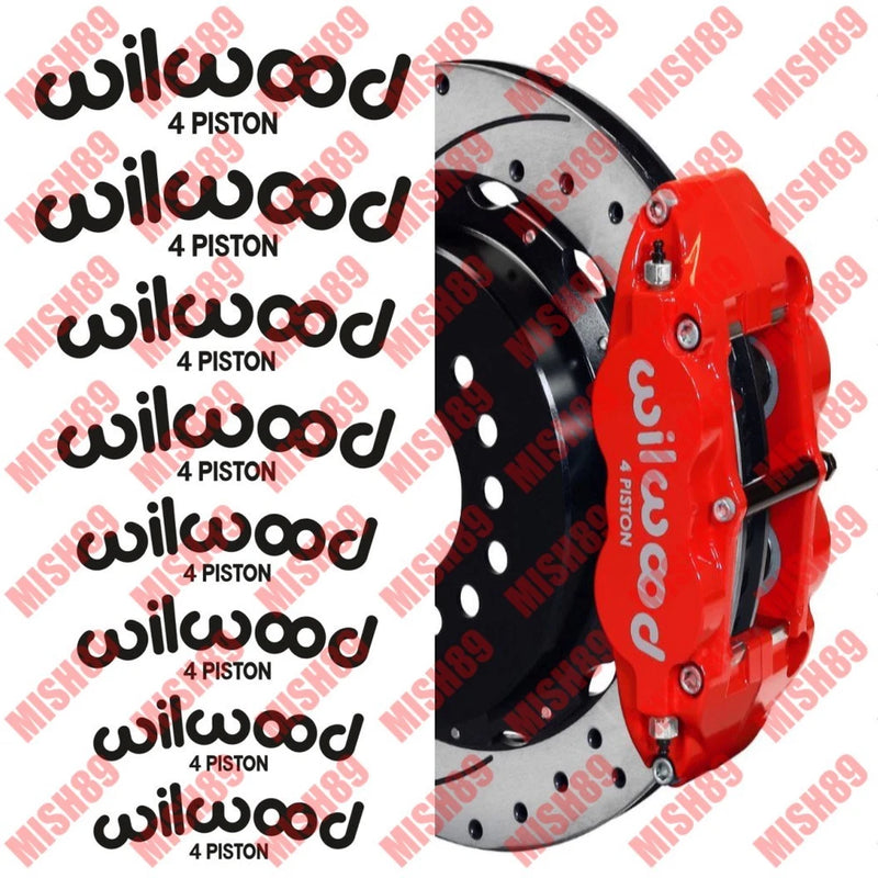 Red 4-piston brake caliper with Wilwood decal sticker, decorative rose accents