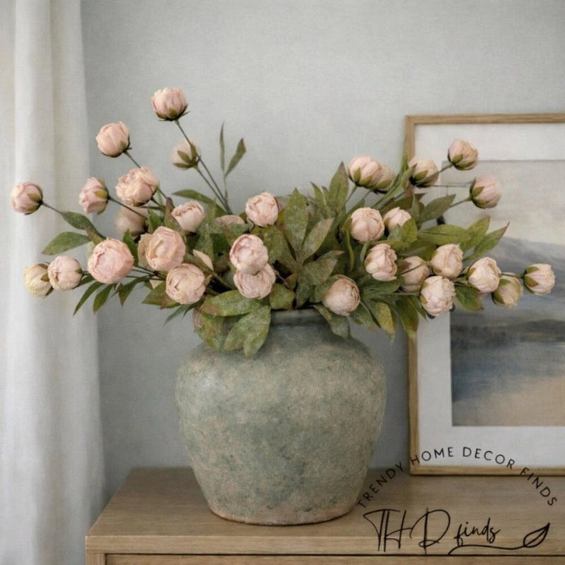 Artificial peony flower stems with tan blossoms and green leaves