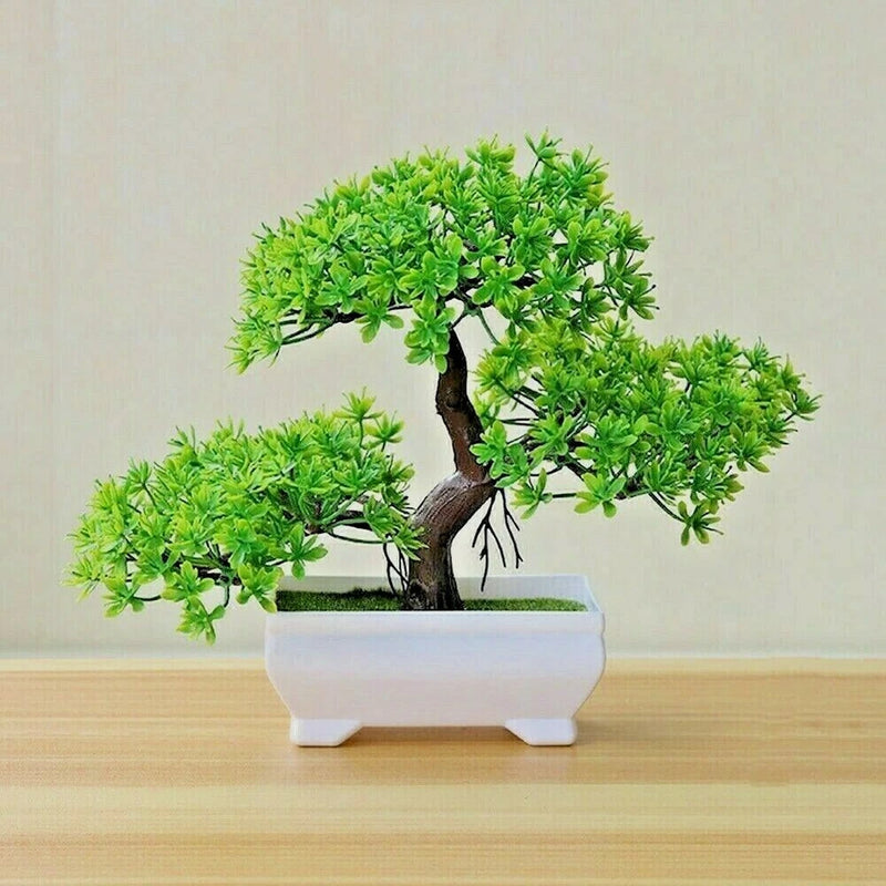 Artificial bonsai-style plant with bright green foliage in a white square planter