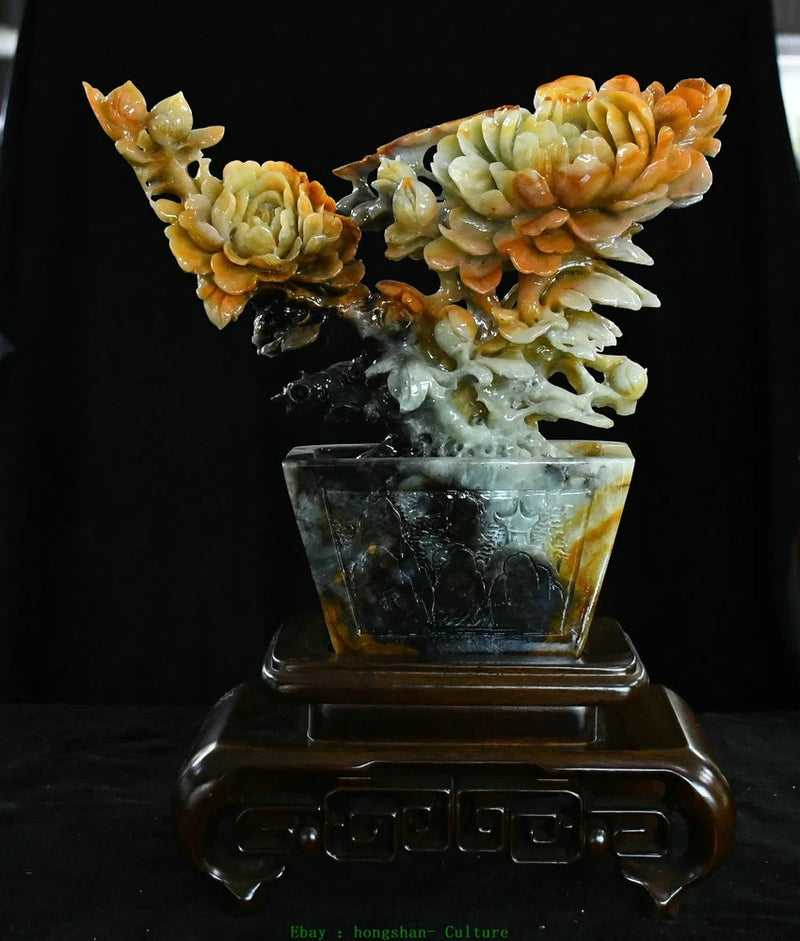 Carved jade peony flower statue in dark square pot with ornate base