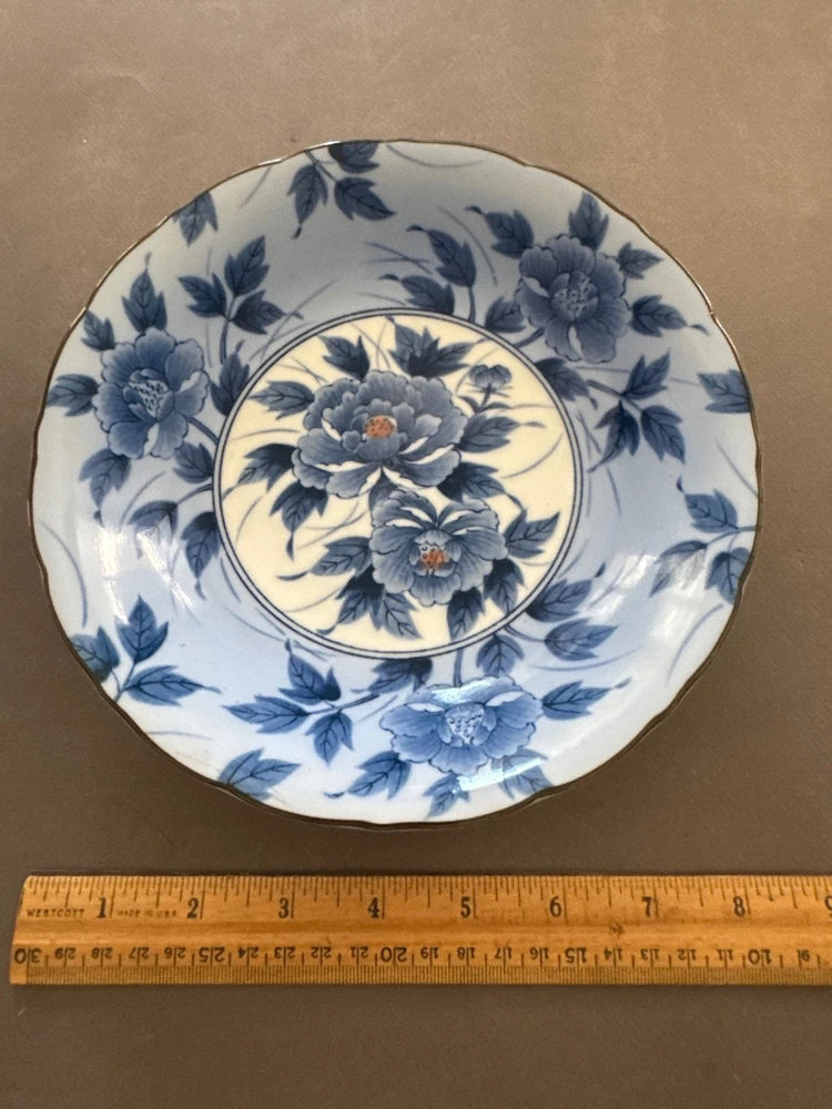 Vintage porcelain bowl with blue peony and floral border, round shallow dish