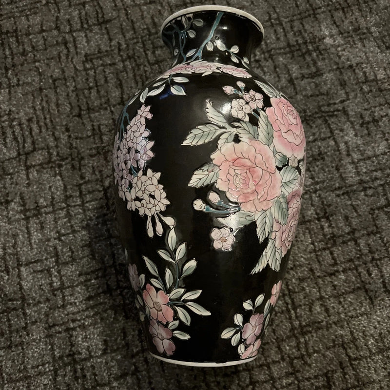 Black porcelain vase with pink roses and floral leaves, rounded shape