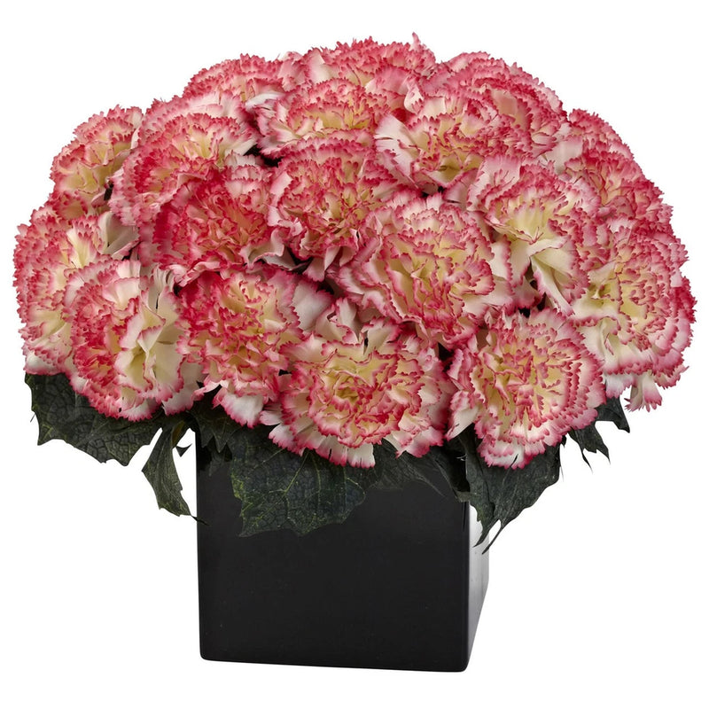 Pink and cream artificial carnation flower centerpiece in dark vase