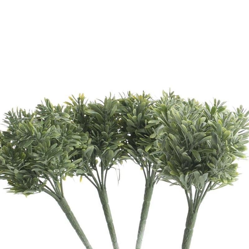 Package of 4 small artificial green floral shrub bushes with dense leafy sprigs