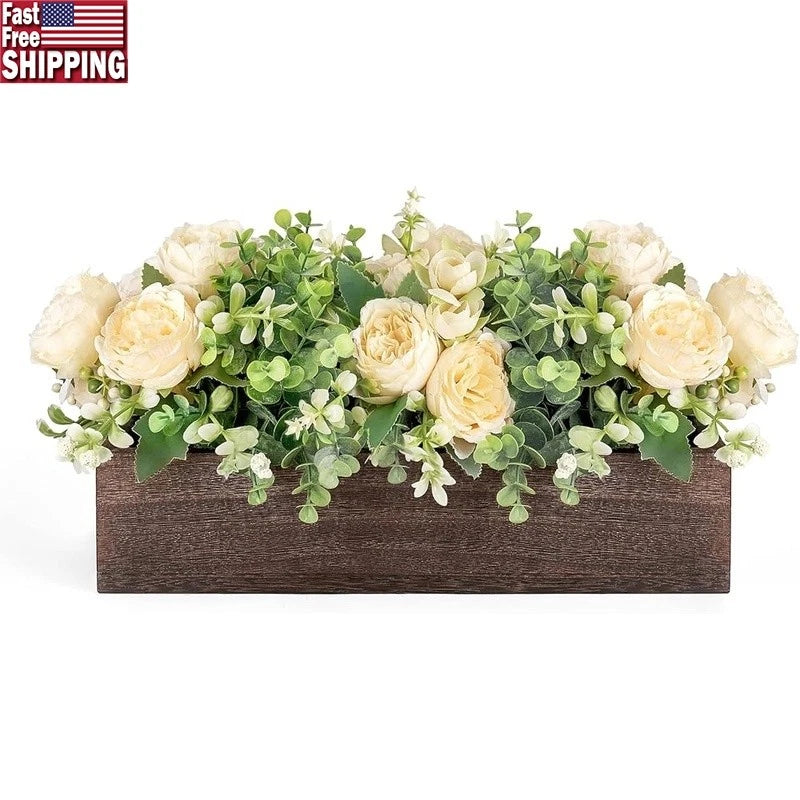 Dark brown wooden box floral centerpiece with cream peonies, roses, and green eucalyptus