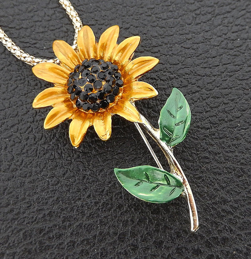 Sunflower pendant long necklace with yellow petals, black crystal center, green leaves