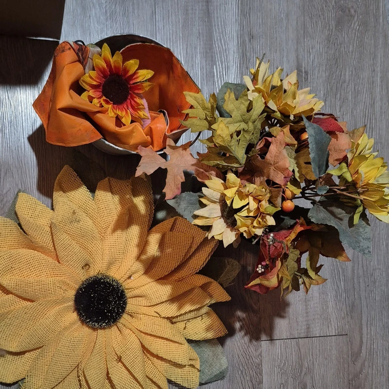 Artificial sunflower fall arrangement with yellow and orange blooms and autumn leaves